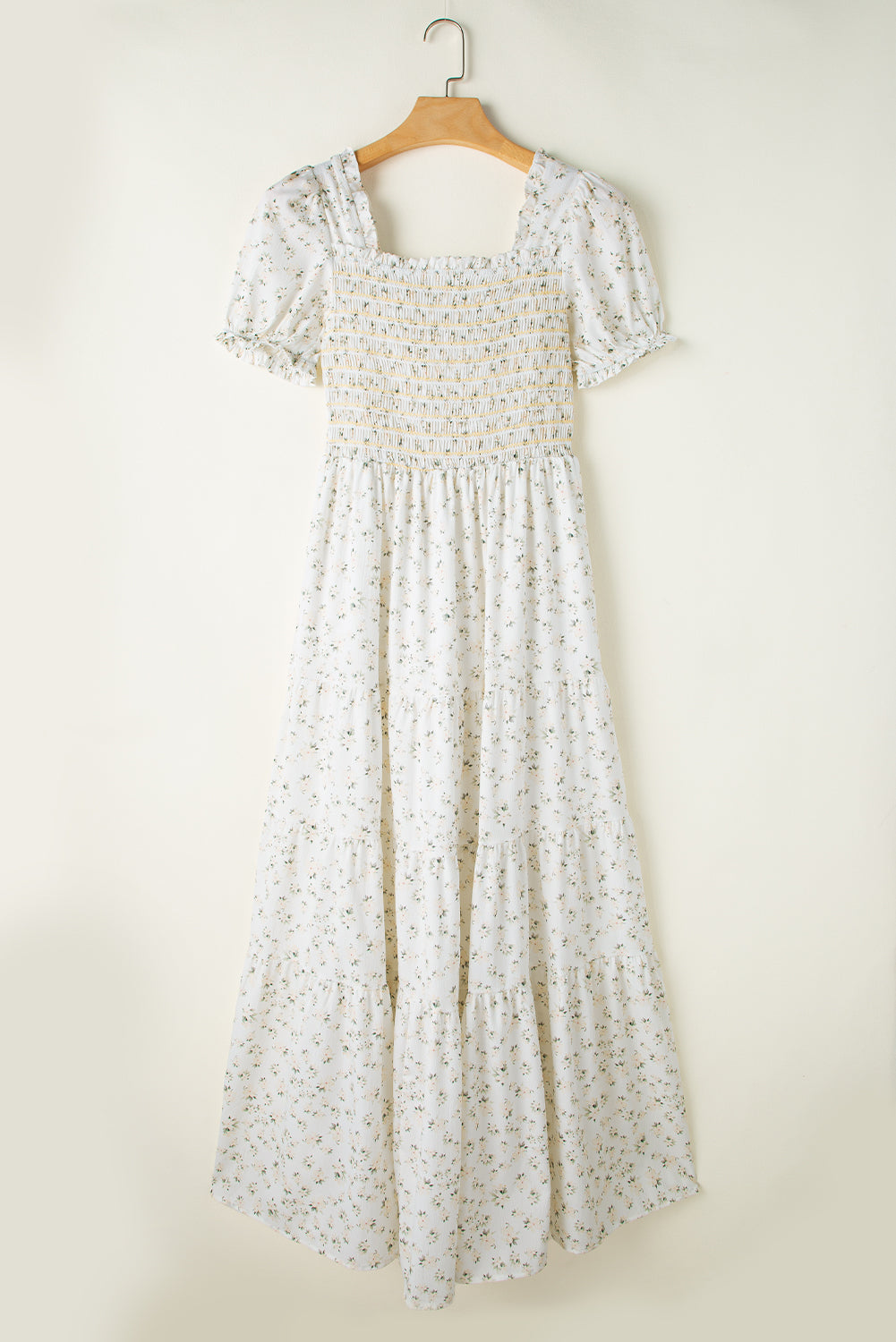 White floral maxi dress with frilly shirred bodice and tiered design by ModestAndDevoted, perfect for casual or special occasions.