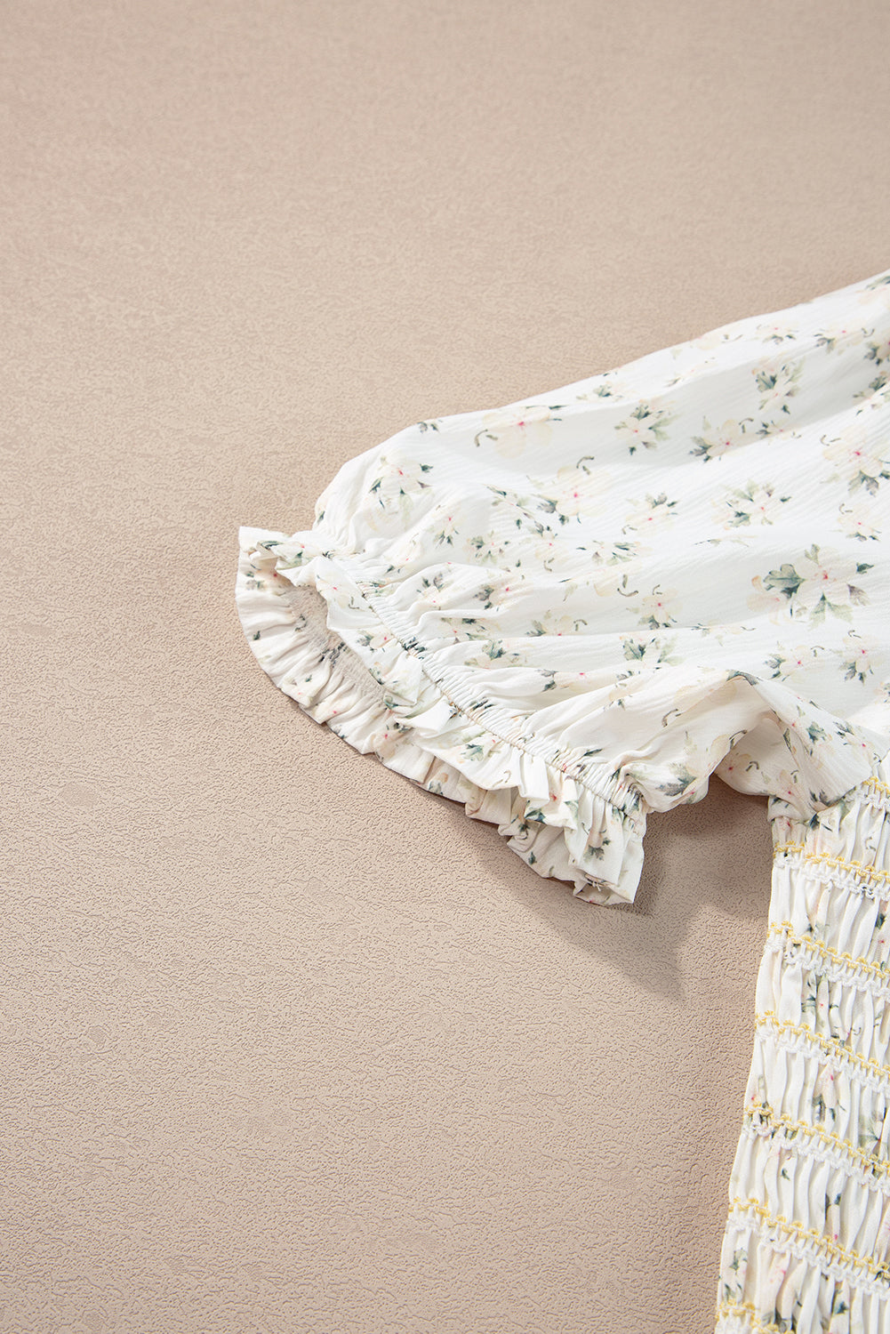 White frilly shirred bodice tiered floral maxi dress from ModestAndDevoted, featuring a flowing design and floral pattern.
