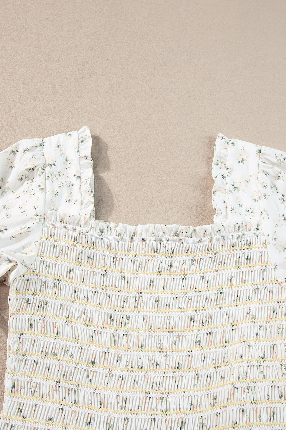 White floral maxi dress by ModestAndDevoted featuring a frilly shirred bodice and tiered layers, perfect for summer wear.