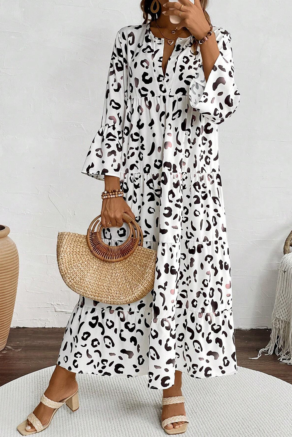 White leopard print maxi dress with notch V-neck and loose fit, by ModestAndDevoted, made of lightweight polyester fabric.