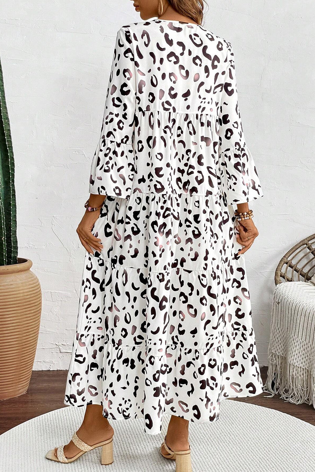 White leopard print maxi dress with notch V-neck and loose fit from ModestAndDevoted, made of lightweight polyester fabric.