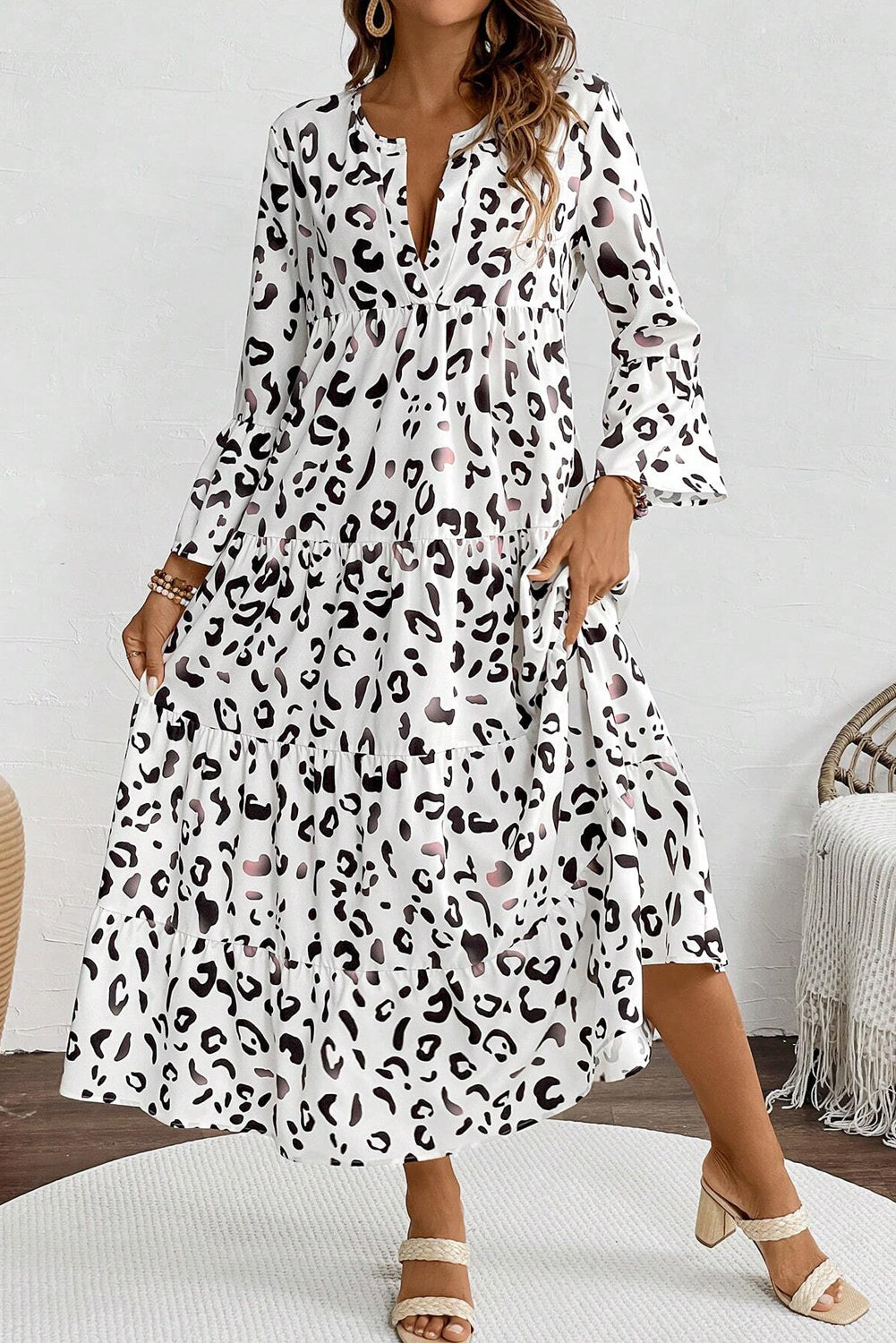 White leopard print maxi dress by ModestAndDevoted featuring a notch V-neck and loose fit, made from lightweight polyester.