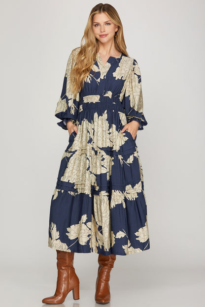 Navy Pintuck Tiered Floral Print Dress by ModestAndDevoted, maxi dress with floral pattern and tiered design, suitable for elegant occasions.