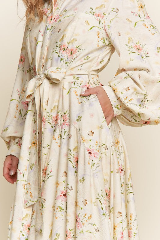 ModestAndDevoted Enchanted Garden floral button-down maxi dress featuring vibrant garden-inspired print and flowing silhouette.