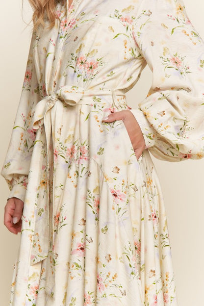 ModestAndDevoted Enchanted Garden floral button-down maxi dress featuring vibrant garden-inspired print and flowing silhouette.