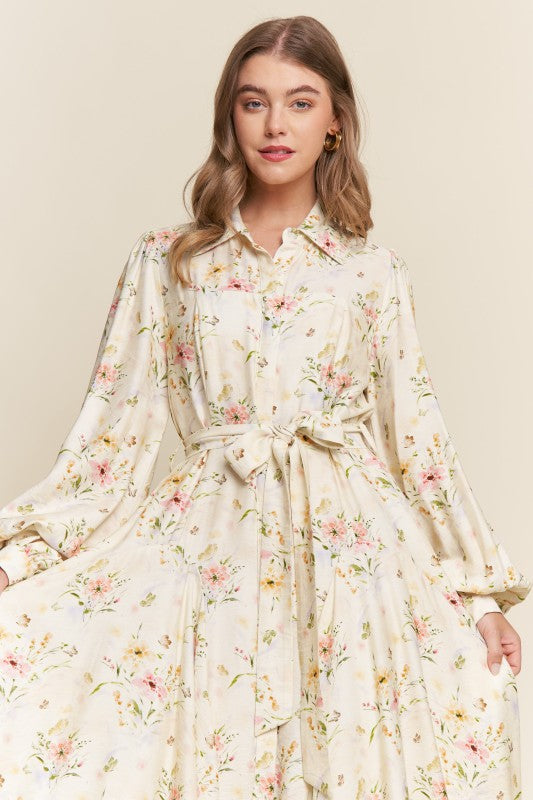 ModestAndDevoted Enchanted Garden floral button-down maxi dress with vibrant garden print and flowing fabric.