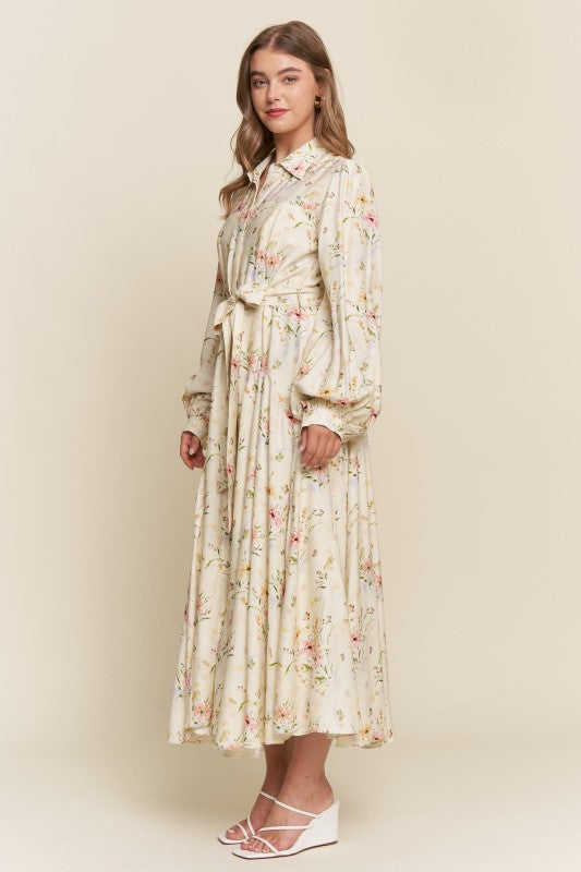 ModestAndDevoted Enchanted Garden floral button-down maxi dress with vibrant garden print and flowing silhouette.