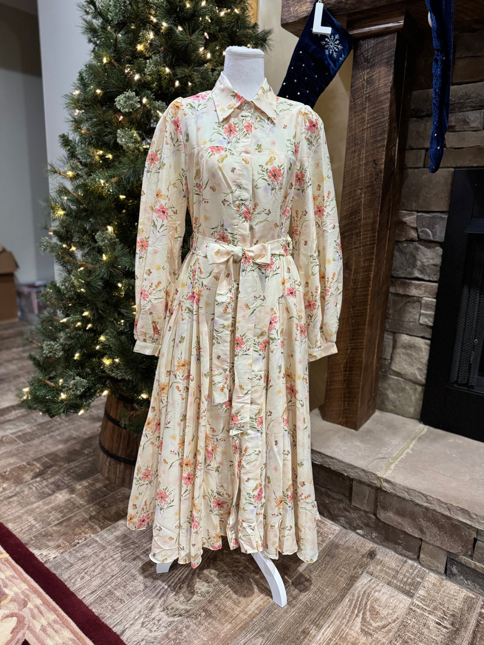 ModestAndDevoted Enchanted Garden floral button-down maxi dress with colorful garden print and flowing silhouette.
