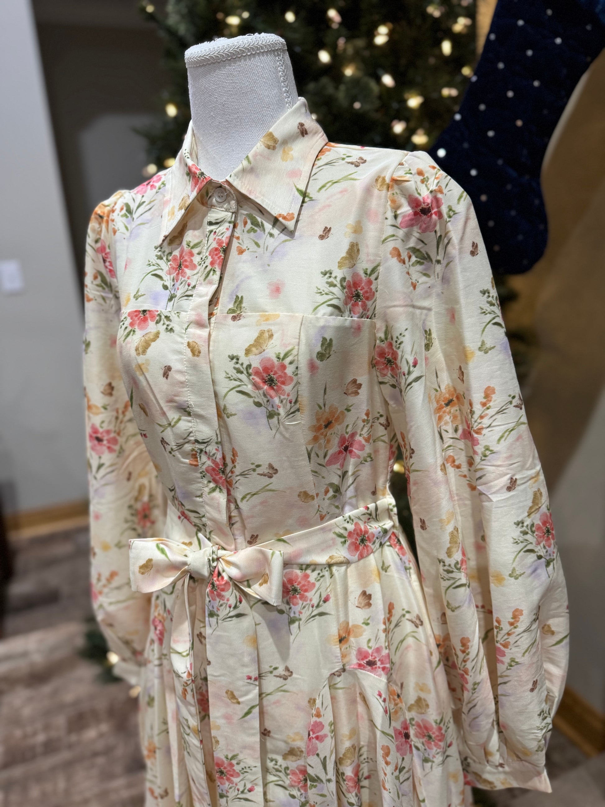 ModestAndDevoted enchanted garden floral maxi dress with button-down front, flowing fabric, and vibrant floral pattern.