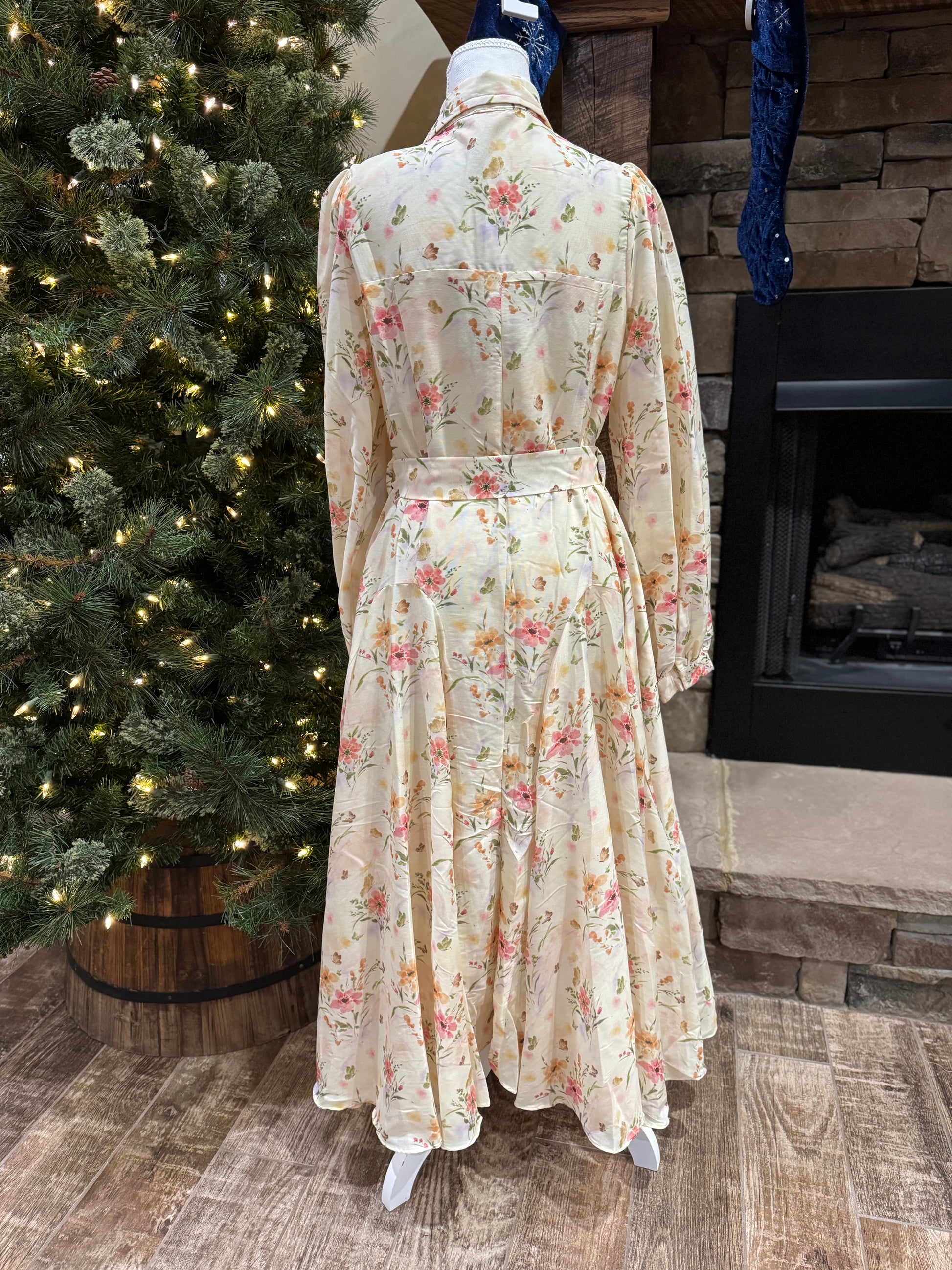ModestAndDevoted floral maxi dress featuring a button-down front, vibrant garden-inspired print, long sleeves, and flowing silhouette.