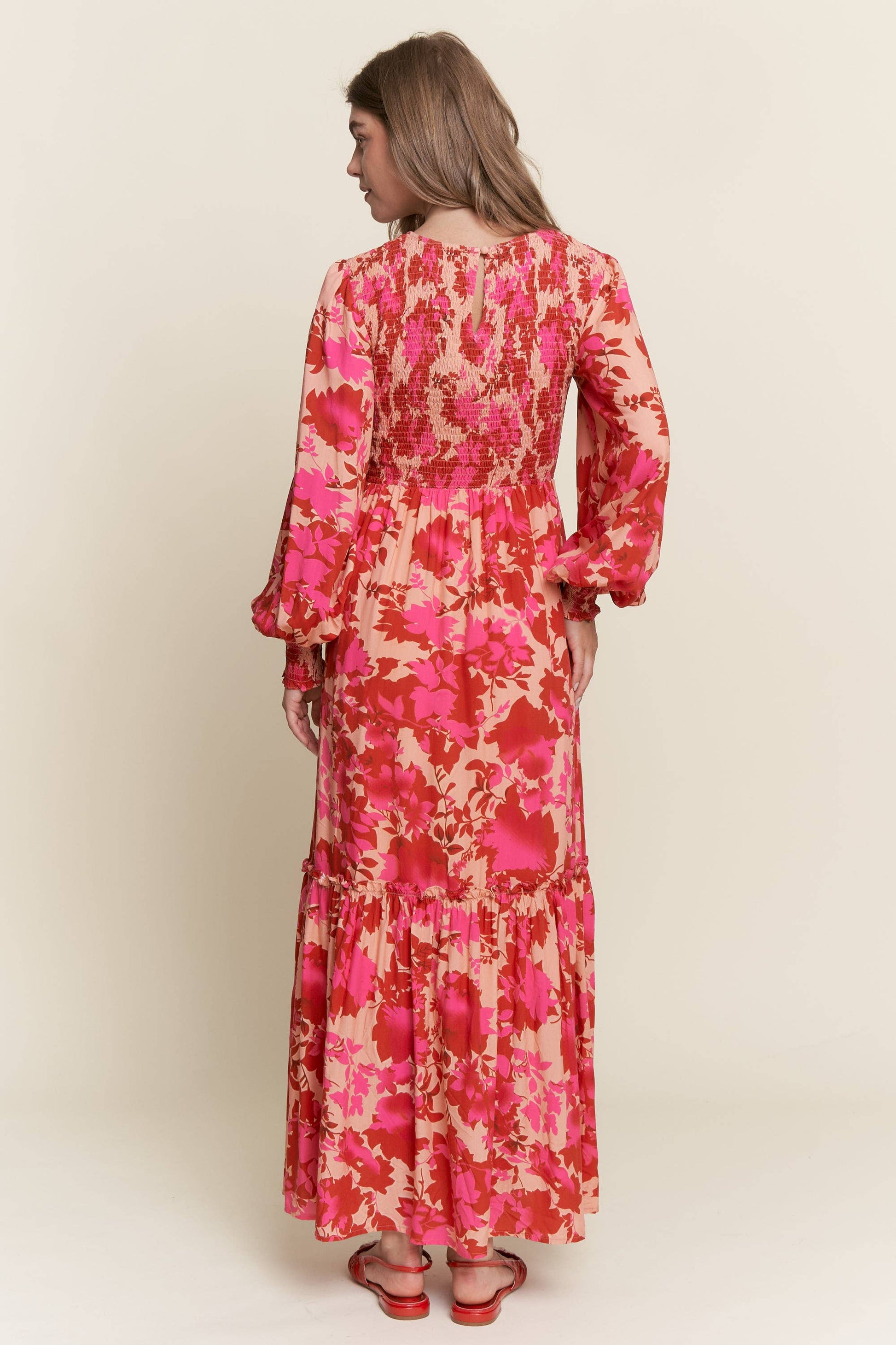 Long sleeve floral dress with smocked bodice by ModestAndDevoted, featuring bright colorful floral patterns.