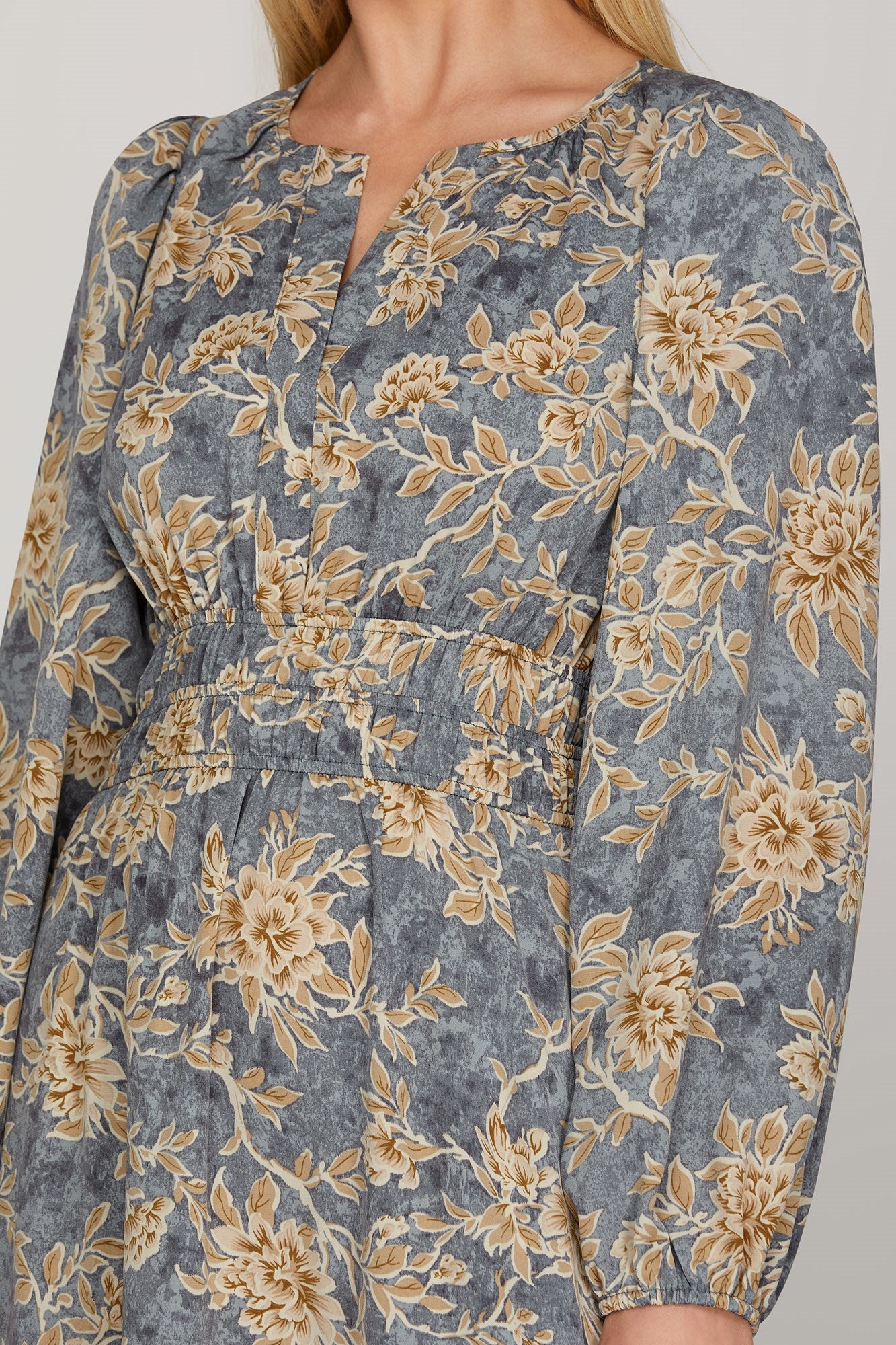 Long sleeve woven scroll print tiered maxi dress in dusty blue by ModestAndDevoted, featuring elegant flowing fabric.