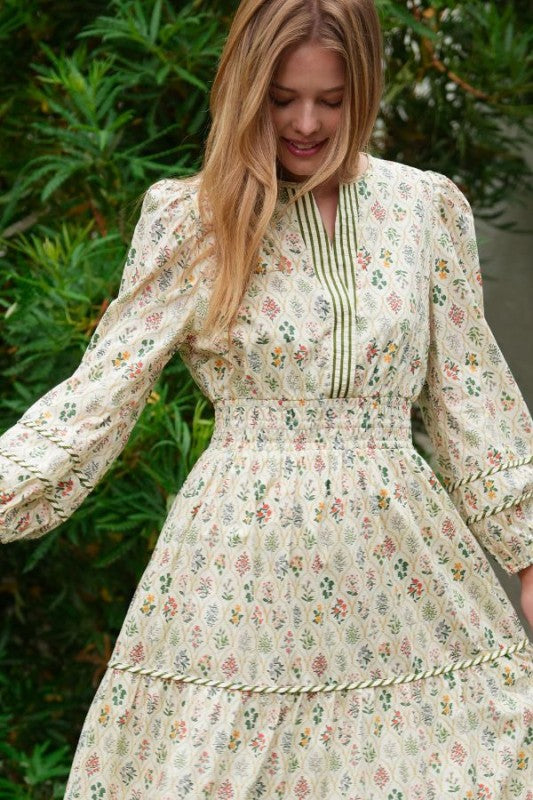 ModestAndDevoted novelty print maxi dress with pockets and detailed trim, flowing fabric and vibrant pattern, full-length view