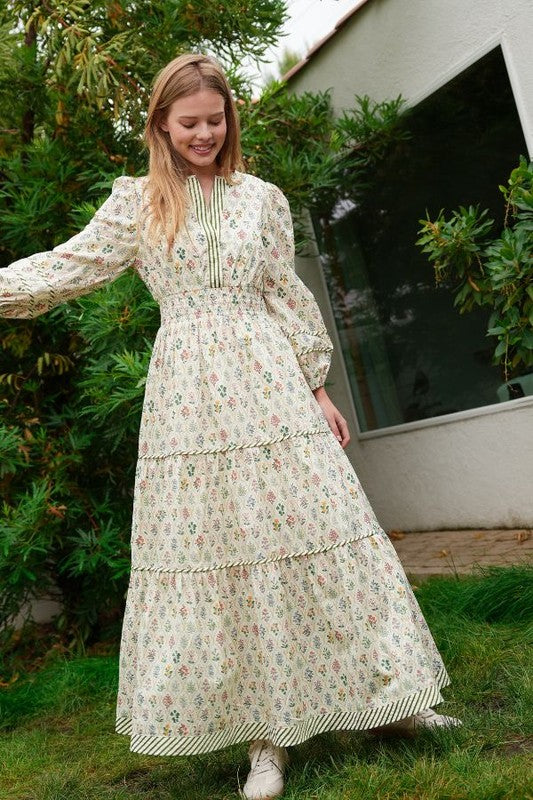 ModestAndDevoted novelty print maxi dress with pockets and detailed trim, flowing fabric, and vibrant design.