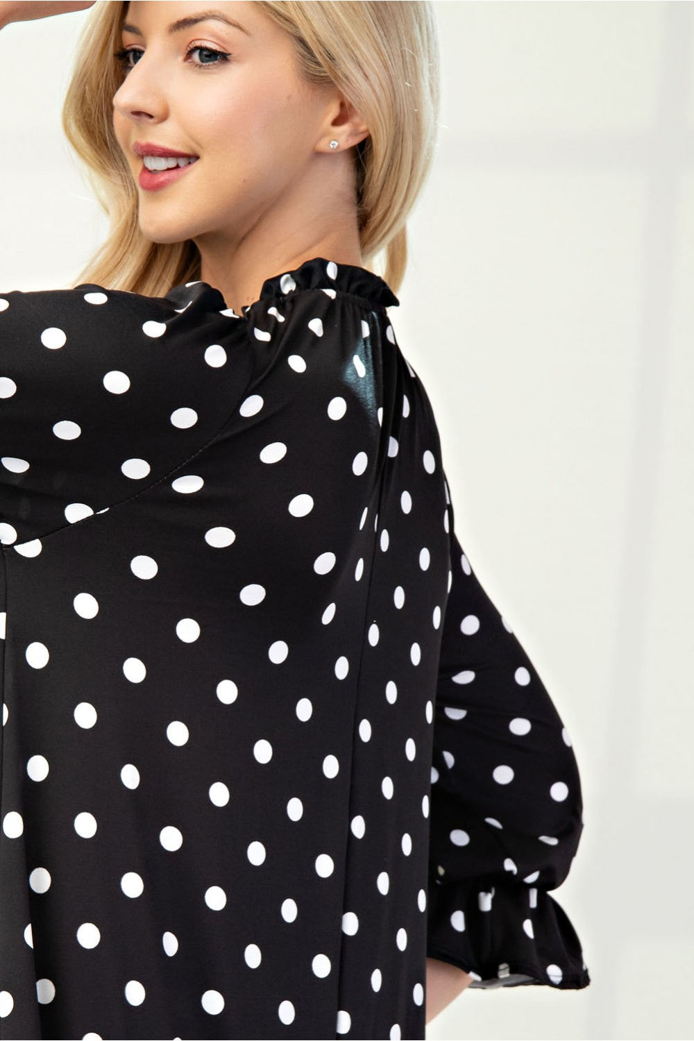 Polka dot 3/4 sleeve ruffle trim dress by ModestAndDevoted, stylish missy size with feminine ruffle details.