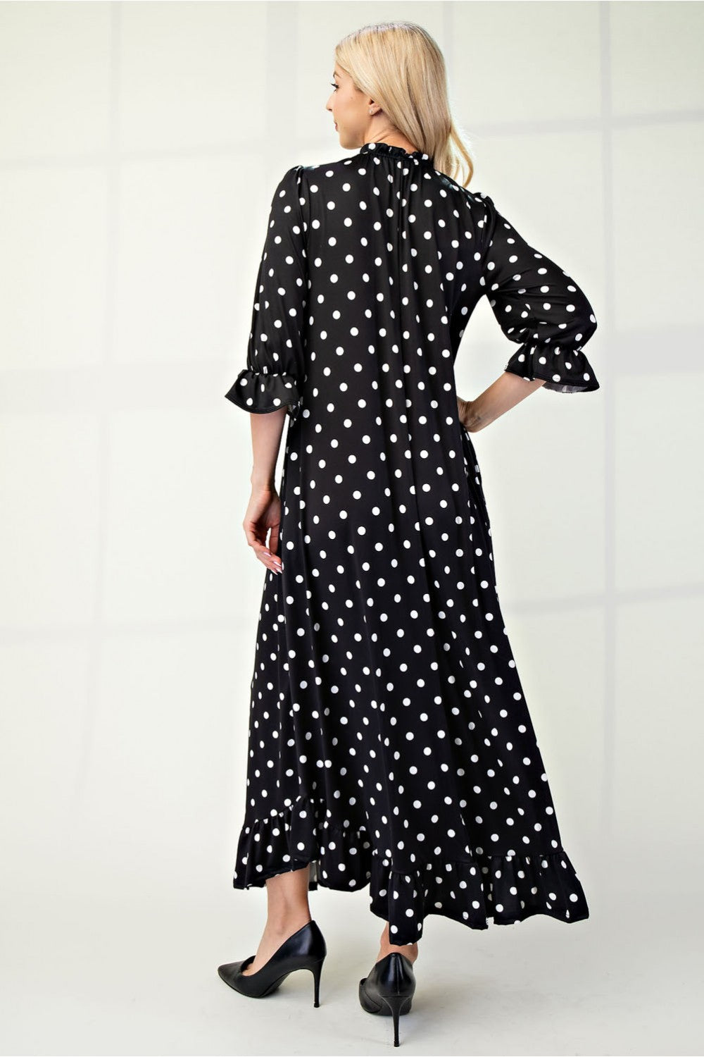 Polka dot 3/4 sleeve ruffle trim dress by ModestAndDevoted, featuring a stylish design and flattering fit for missy size.