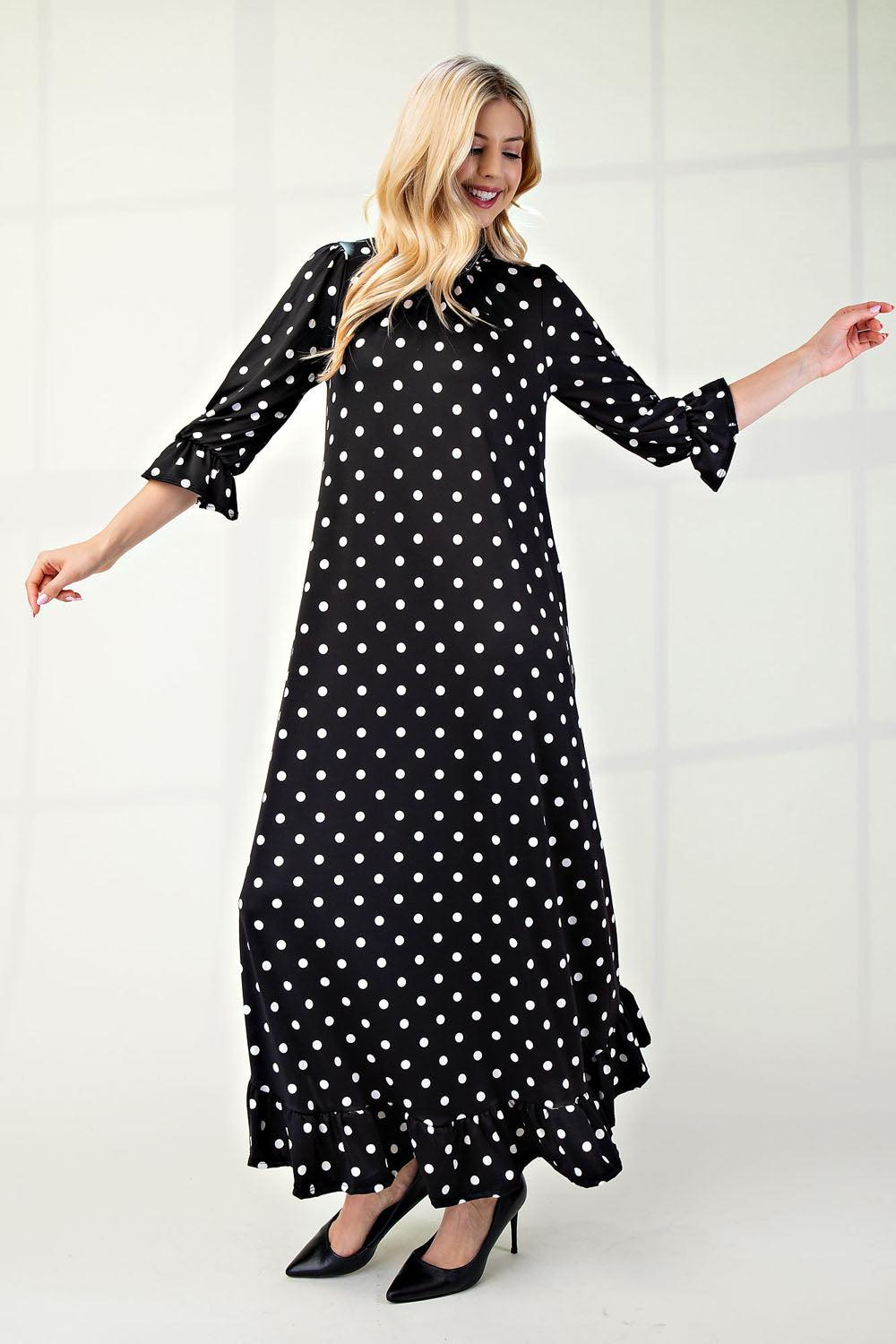 Polka dot 3/4 sleeve ruffle trim dress by ModestAndDevoted, Missy size, featuring a stylish and comfortable design.