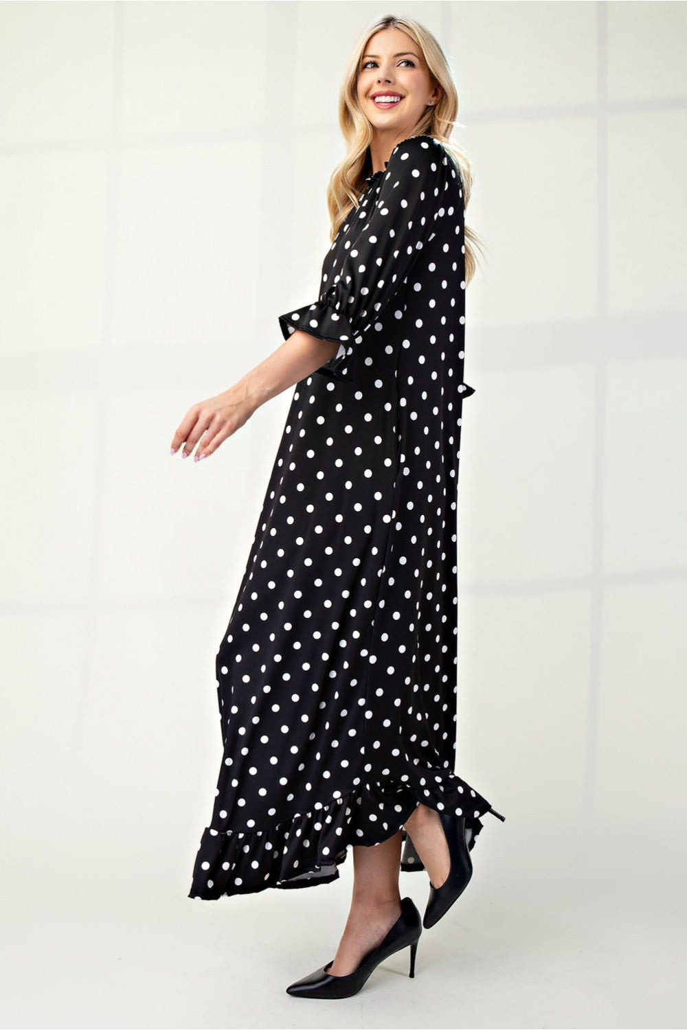 Polka dot 3/4 sleeve ruffle trim dress by ModestAndDevoted, featuring a classic design and flattering fit for missy sizes.