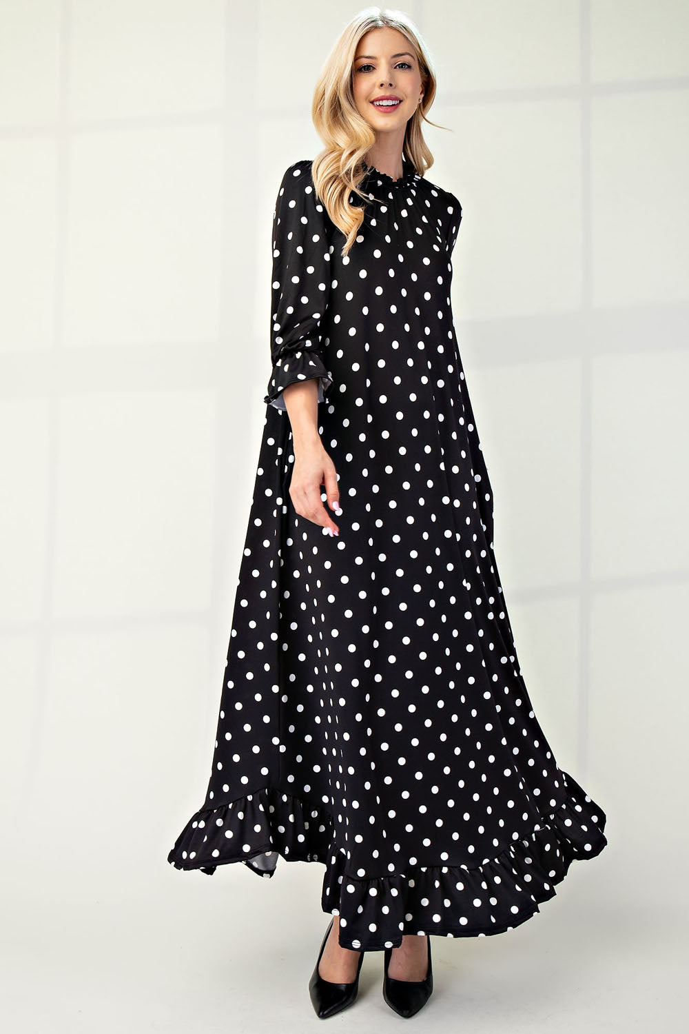 Polka dot 3/4 sleeve ruffle trim dress by ModestAndDevoted, featuring a classic design and flattering fit in missy size.