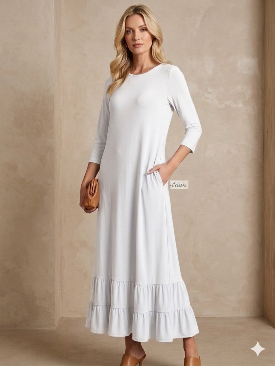 White women's modest maxi dress by ModestAndDevoted featuring elegant, flowing fabric and a comfortable, modest fit.