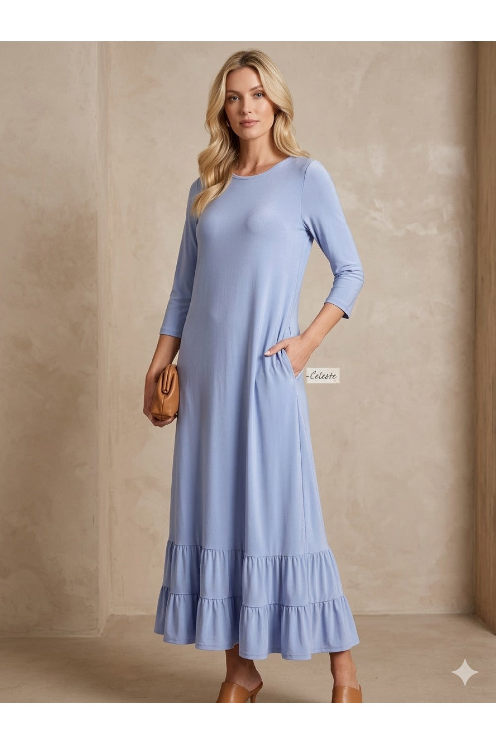 White women's modest maxi dress by ModestAndDevoted, featuring elegant, flowing fabric and a simple, graceful design.