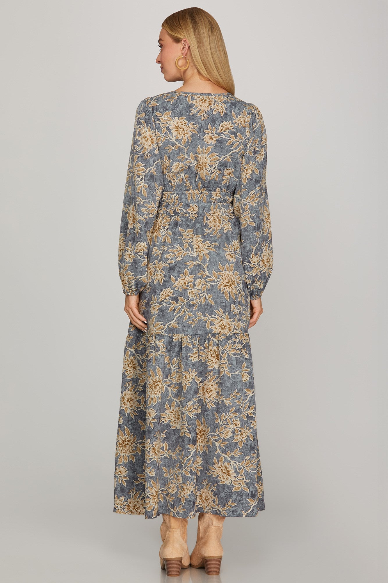 Long sleeve woven scroll print tiered maxi dress in dusty blue by ModestAndDevoted, featuring a flowing, elegant design.