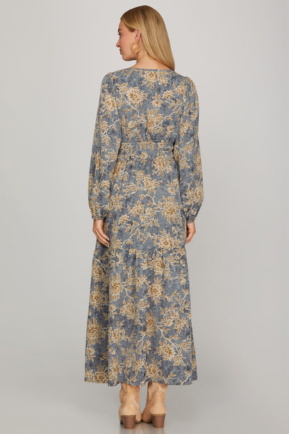 Long sleeve woven scroll print tiered maxi dress in dusty blue by ModestAndDevoted, featuring a flowing silhouette and elegant design.