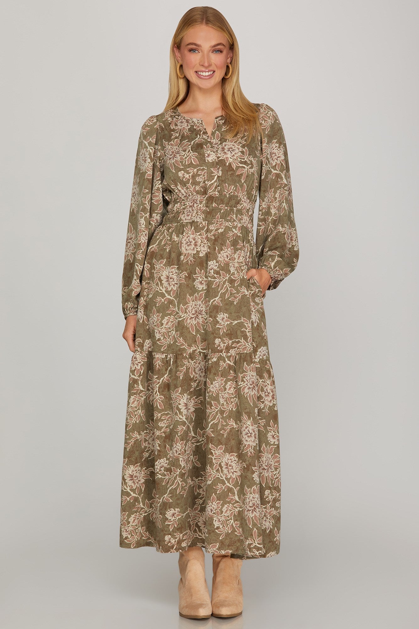 Long sleeve woven scroll print tiered maxi dress in olive from ModestAndDevoted, featuring a flowing silhouette and elegant design.