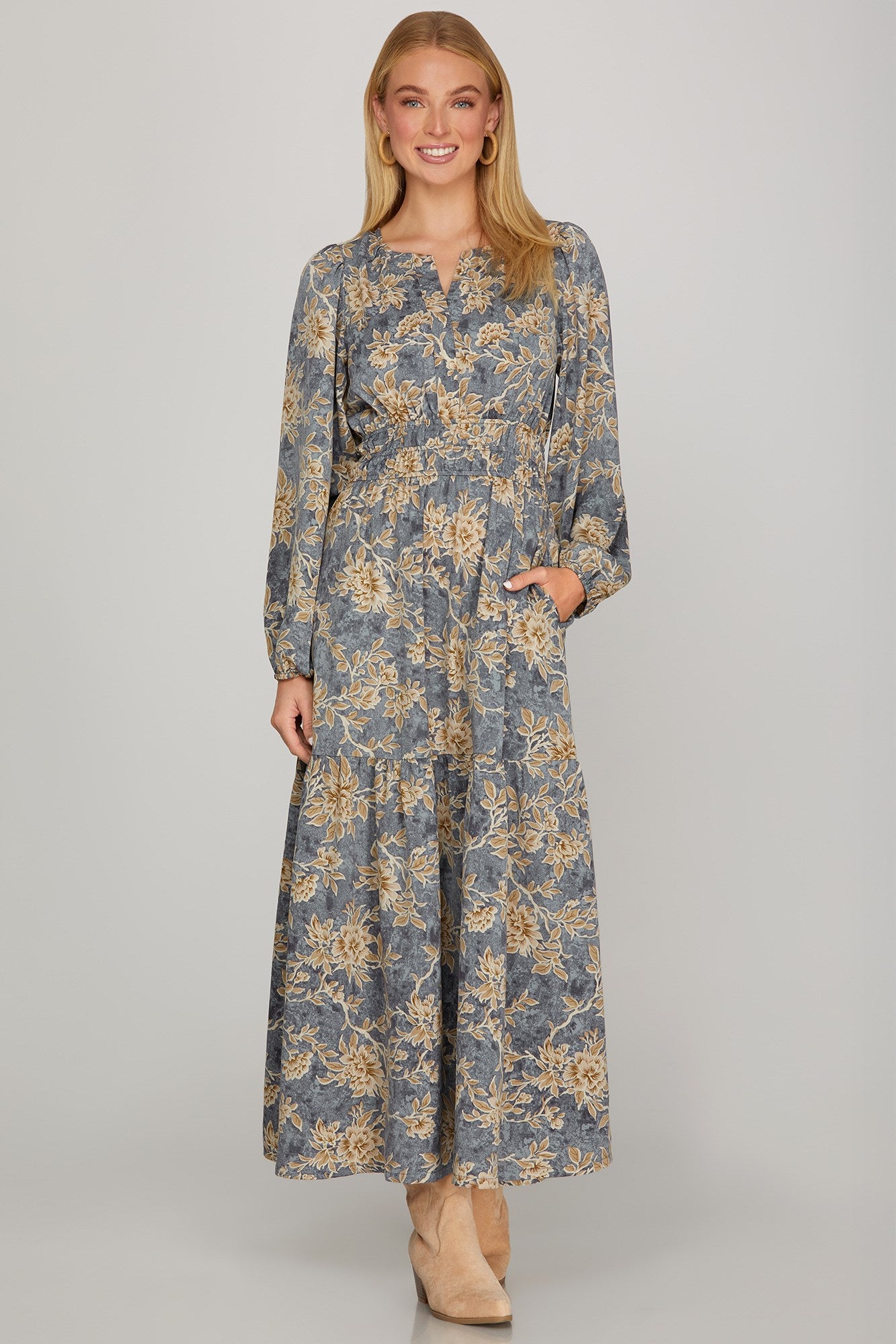Dusty blue long sleeve woven scroll print tiered maxi dress by ModestAndDevoted, featuring a flowing, elegant design.