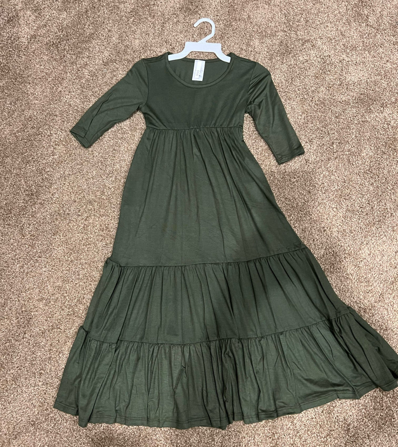 Girls solid green tiered maxi dress by ModestAndDevoted, featuring a flowing, layered design perfect for casual or special occasions.
