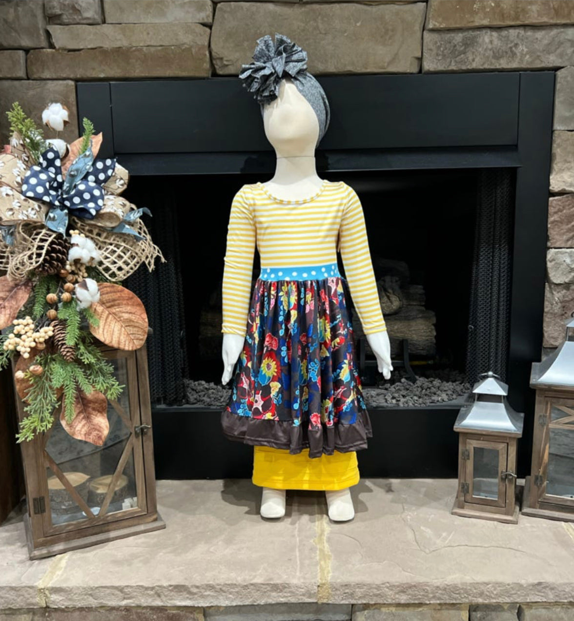 Girls tunic dress by ModestAndDevoted with brown and yellow stripes and floral pattern, featuring a comfortable, stylish design.