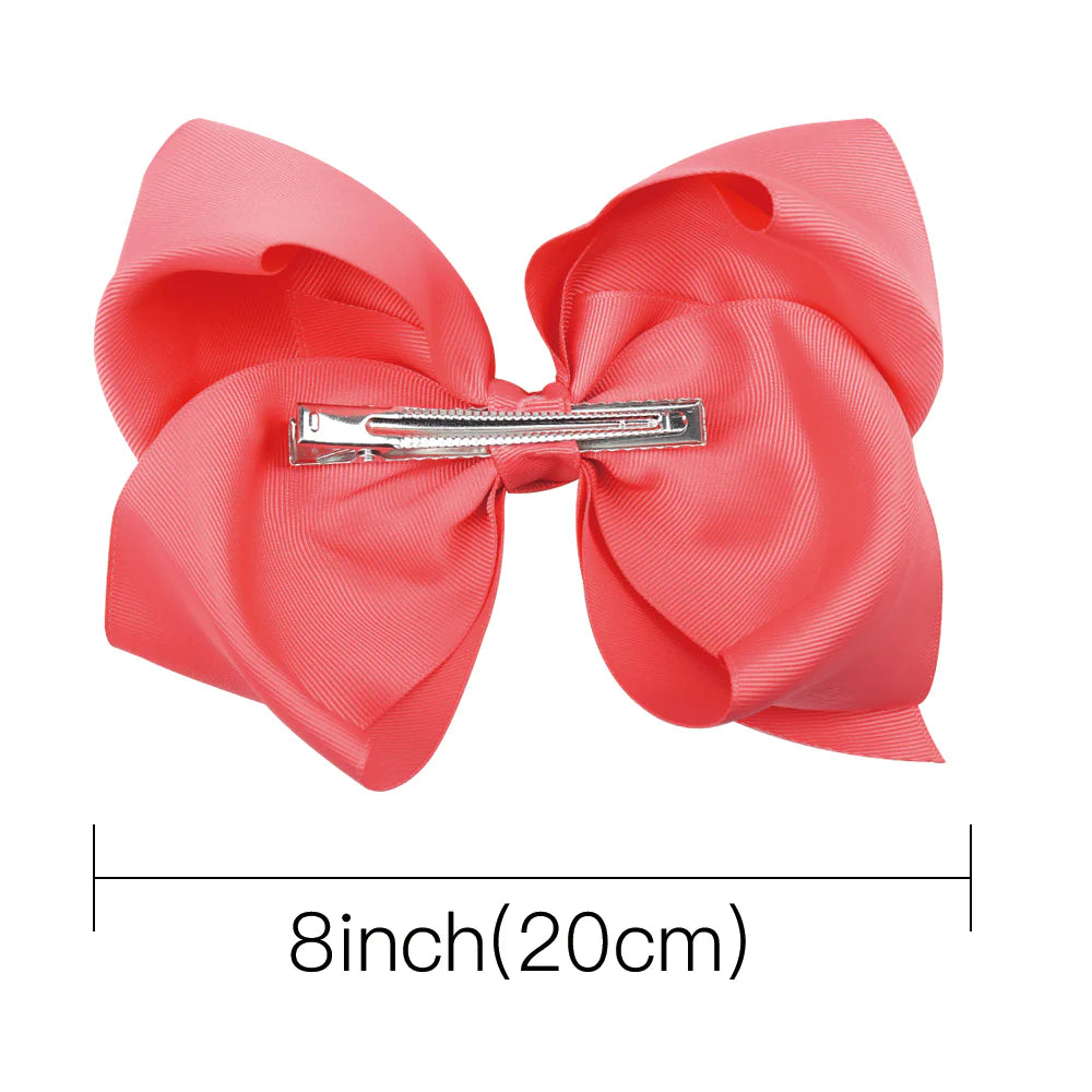 8-inch Jumbo Hairbow by ModestAndDevoted featuring a large, colorful boutique hair accessory with layered fabric design