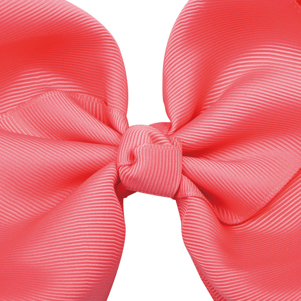 Large 8-inch boutique jumbo hairbow by ModestAndDevoted, featuring soft fabric and elegant design perfect for special hairstyles.