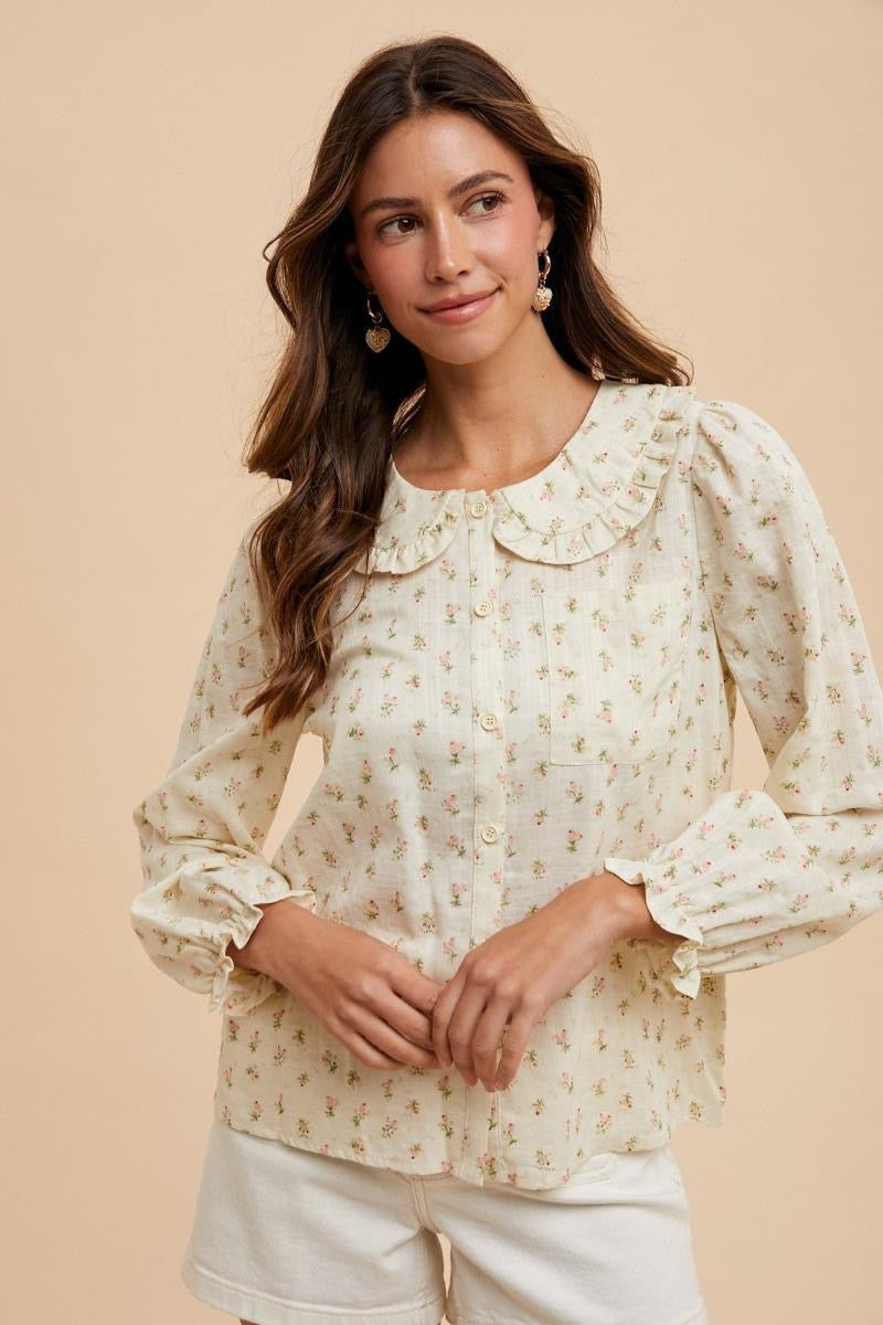 Long sleeve floral button-down blouse with Peter Pan collar by ModestAndDevoted, featuring a dainty ditsy floral print.