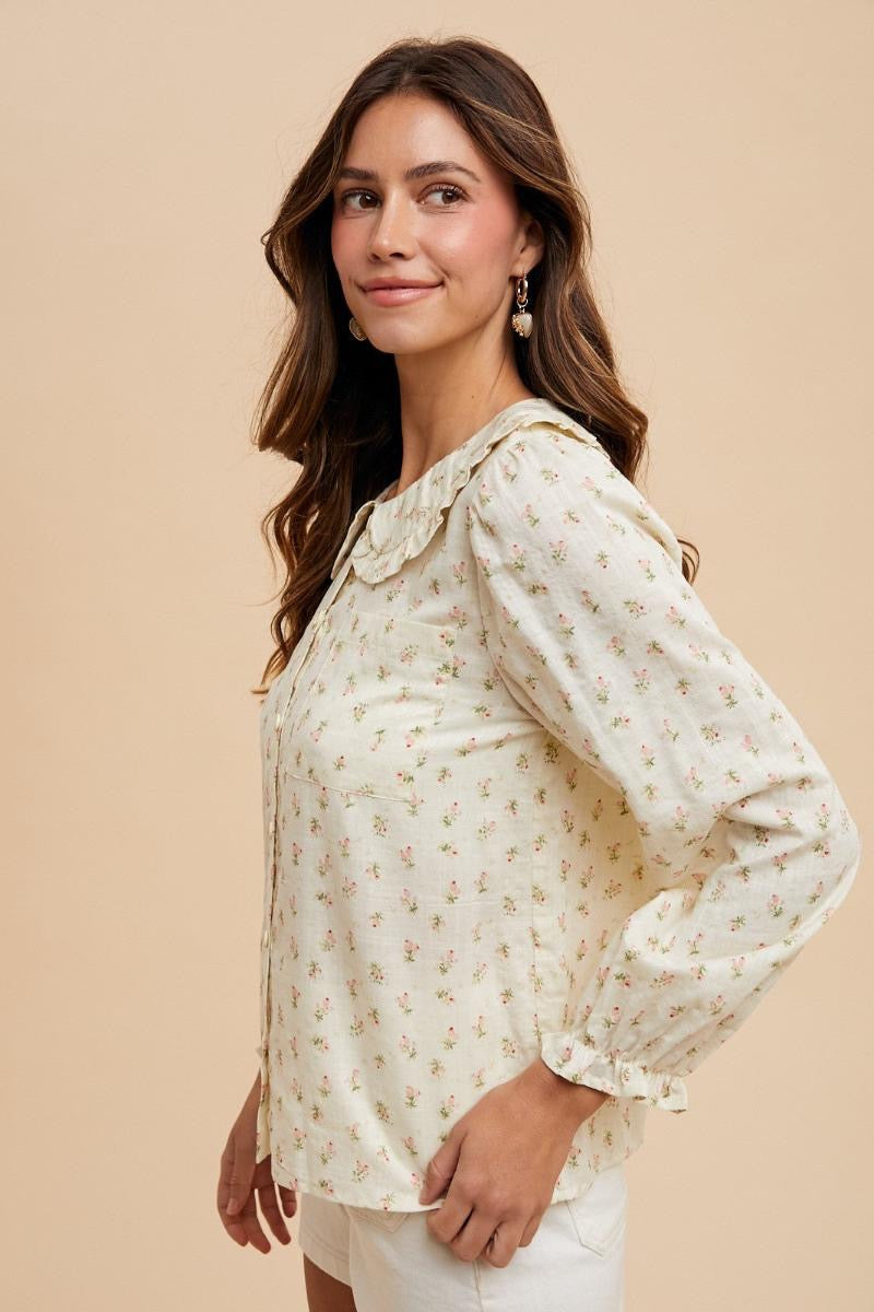 Dainty ditsy floral long sleeve blouse with Peter Pan collar by ModestAndDevoted, featuring button-down front and feminine design.