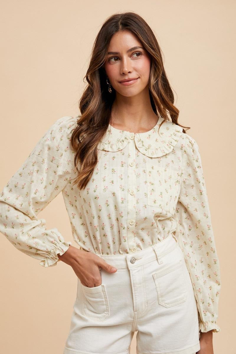 Long sleeve floral blouse by ModestAndDevoted featuring a dainty ditsy print and a Peter Pan collar.