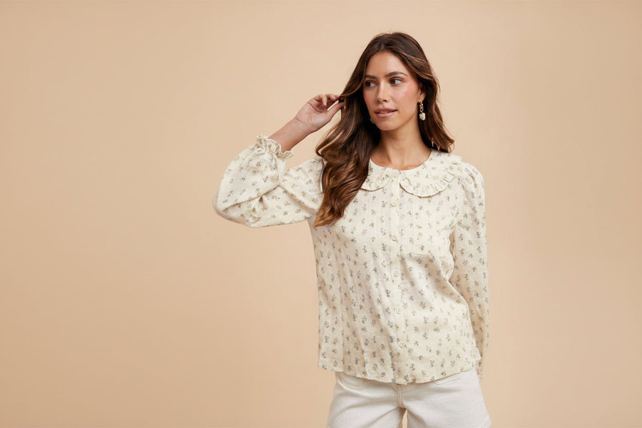 ModestAndDevoted long sleeve blouse with dainty ditsy floral pattern, button-down front, and Peter Pan collar.