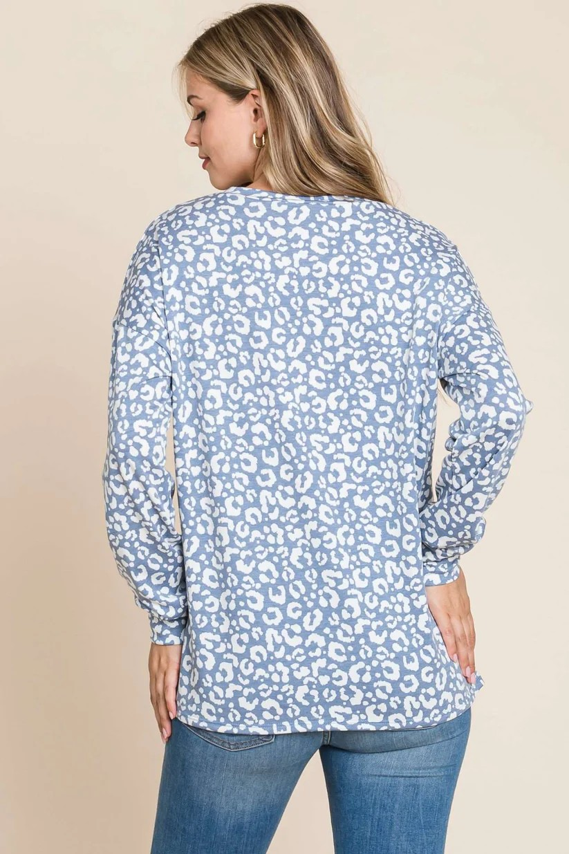 Blue long sleeve animal print top by ModestAndDevoted, featuring a stylish and comfortable design with a distinctive pattern.