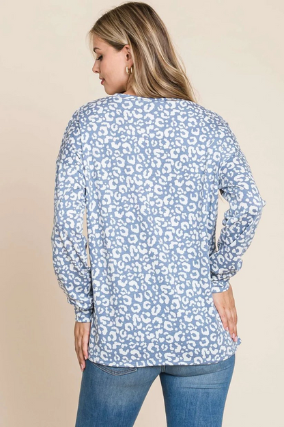 Blue long sleeve animal print top by ModestAndDevoted, featuring a stylish and comfortable design with a distinctive pattern.