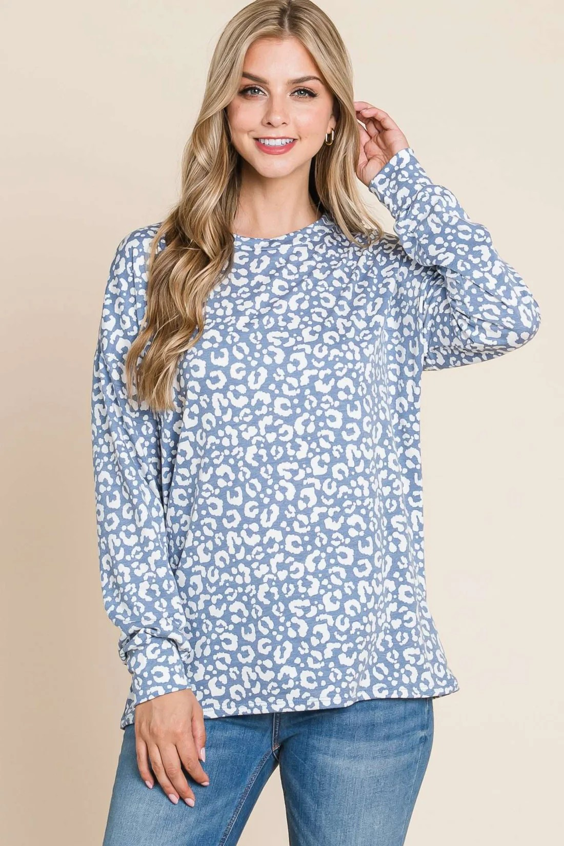 Blue long sleeve animal print top by ModestAndDevoted, featuring a stylish design with a comfortable fit.
