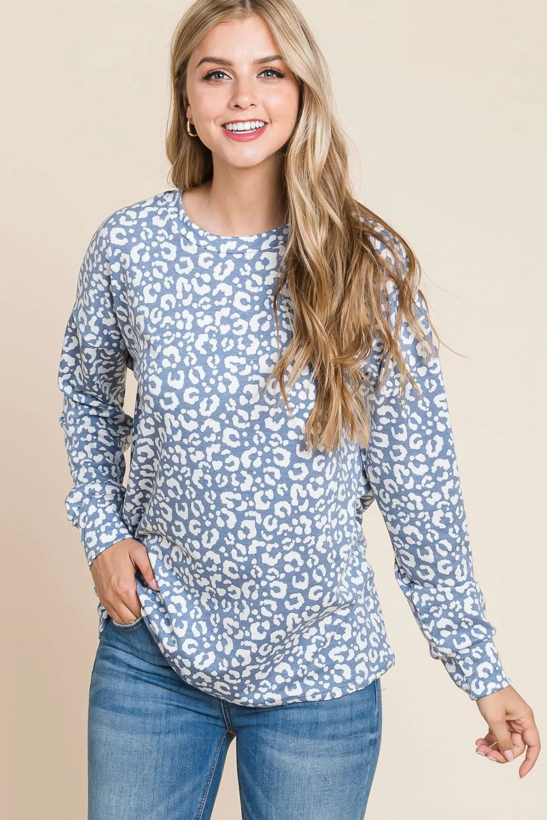 Blue long sleeve animal print top by ModestAndDevoted, featuring a stylish animal pattern and comfortable fit.