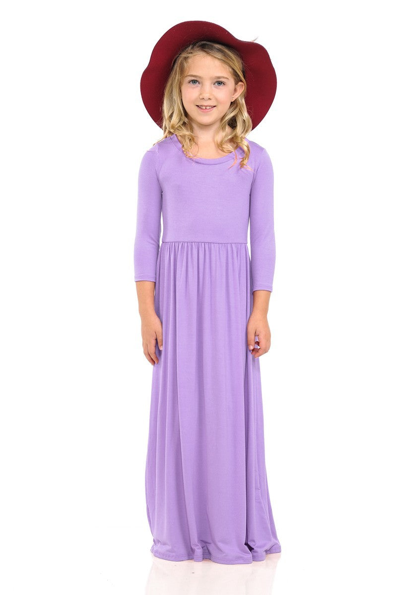 Girls solid peach maxi dress by ModestAndDevoted, soft fabric, sleeveless design, perfect for warm weather and casual occasions.