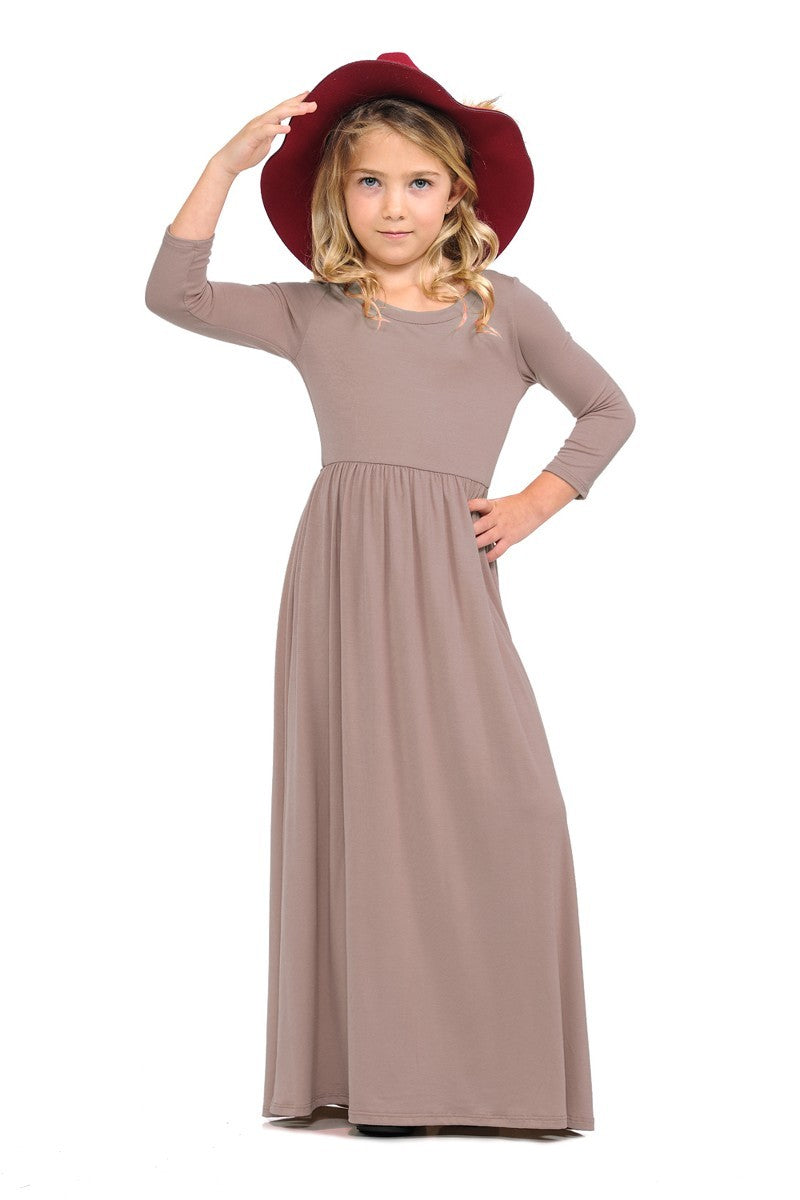 Girls solid peach maxi dress by ModestAndDevoted, featuring a comfortable and stylish long dress for young girls.