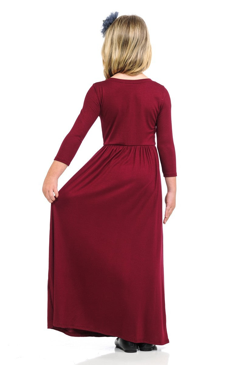 Girls solid peach maxi dress by ModestAndDevoted, featuring a long, flowing design perfect for casual or special occasions.