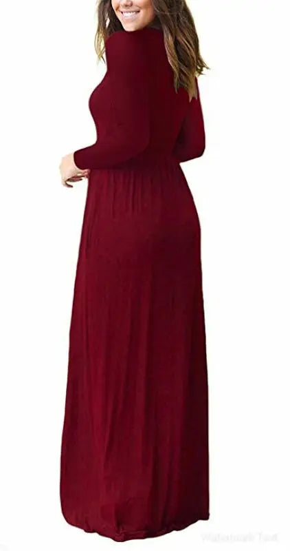 Deep red women's long sleeve maxi dress with pockets by ModestAndDevoted, featuring a flowing design and comfortable fit.