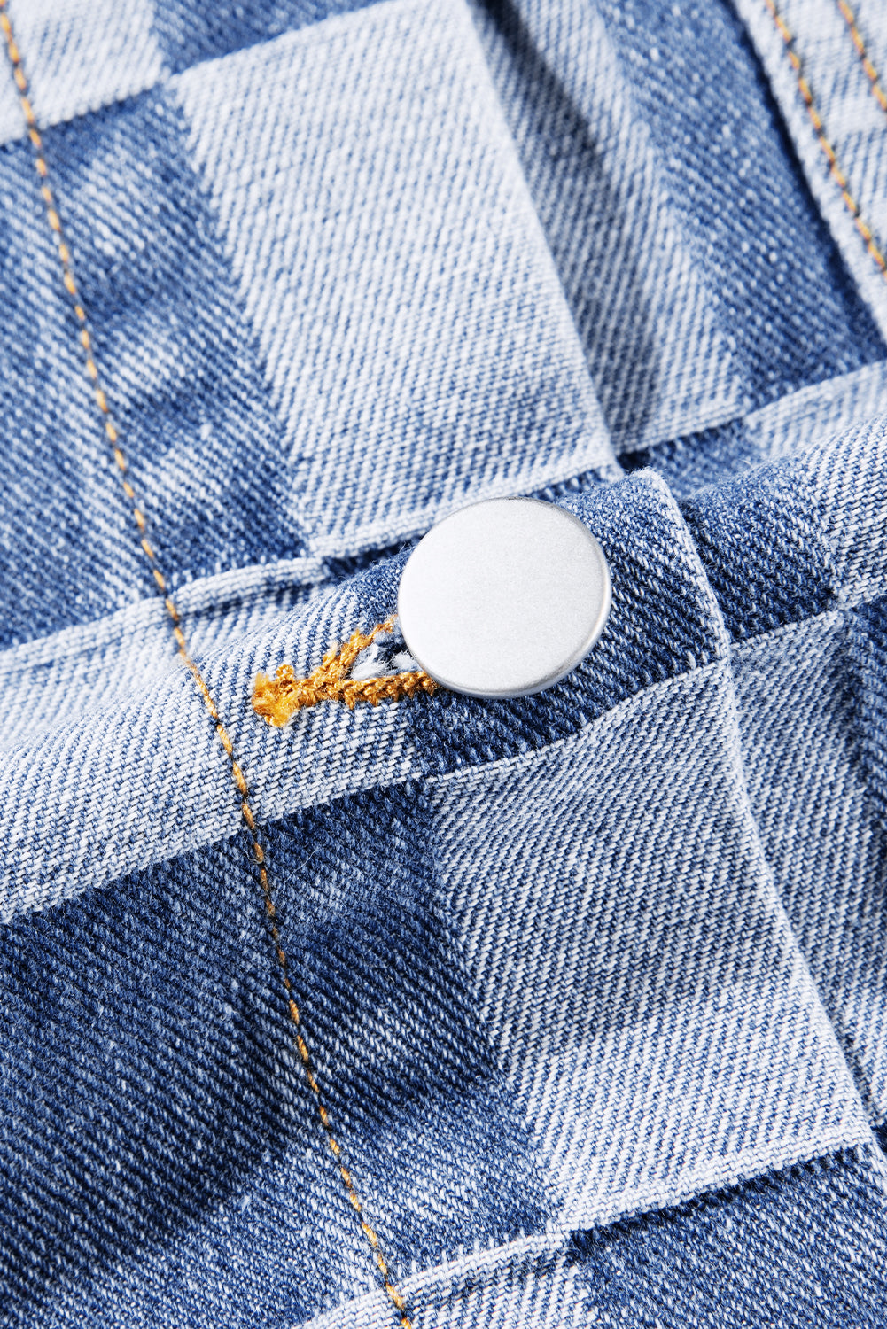 Light blue checkered patchwork denim jacket from ModestAndDevoted, featuring button-up front and classic outerwear style.