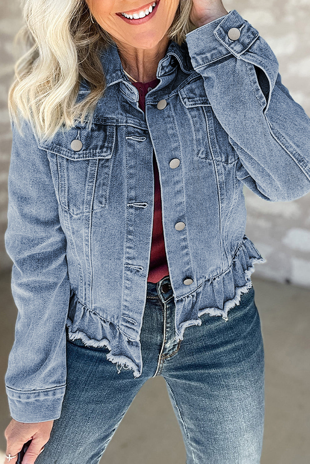 Beau Blue Ruffle Raw Hem Denim Jacket with flap pockets by ModestAndDevoted, featuring stylish ruffles and distressed raw hem detail.