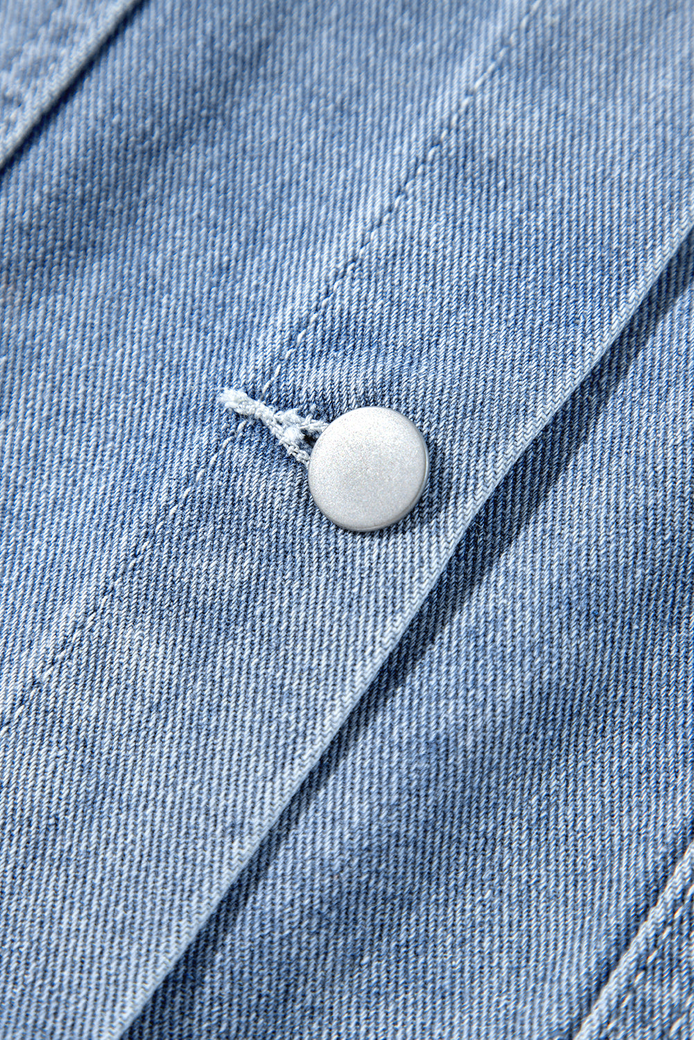 Beau Blue Ruffle Raw Hem Flap Pockets Denim Jacket by ModestAndDevoted, stylish outerwear with ruffled details and flap pockets.