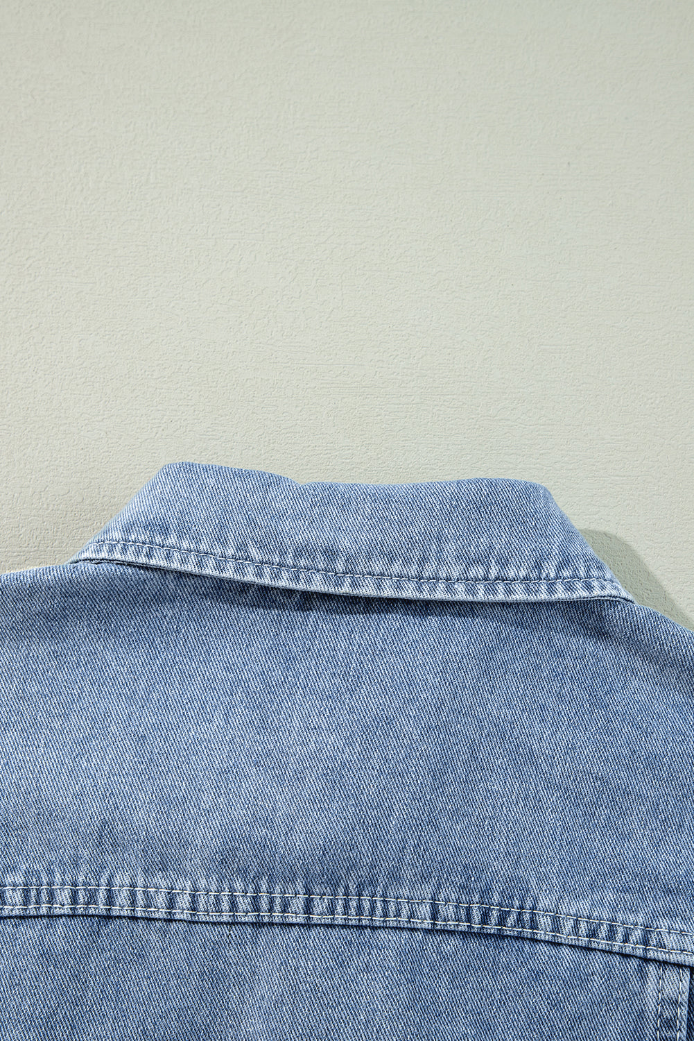Beau Blue denim jacket with ruffle detail, raw hem, flap pockets, ModestAndDevoted outerwear, casual stylish women's jacket.