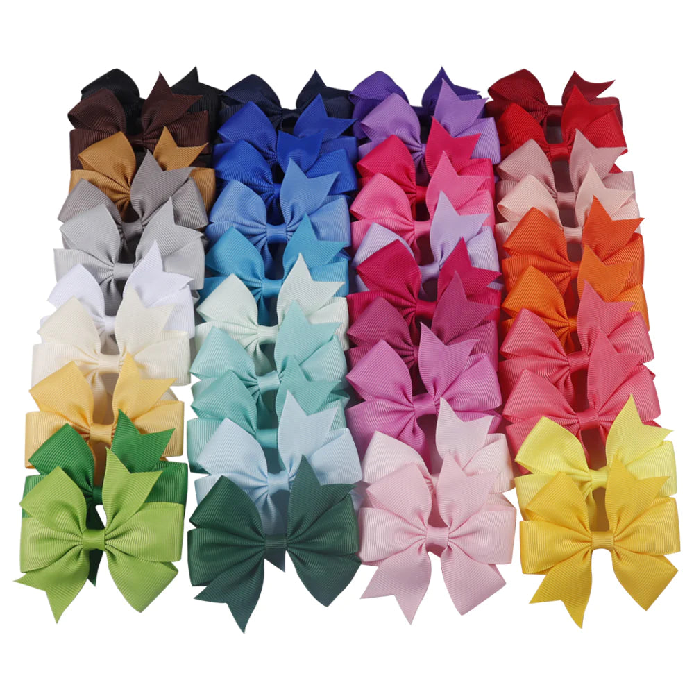 Colorful 3-inch boutique pinwheel hairbow by ModestAndDevoted, featuring vibrant fabric and a cute, playful design for girls' hair accessories.